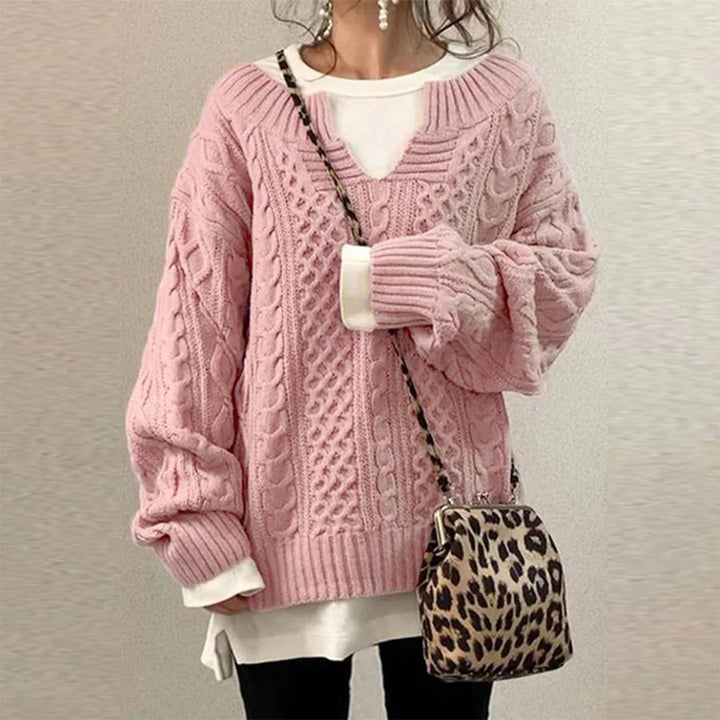 Oversized knit sweater with cable pattern