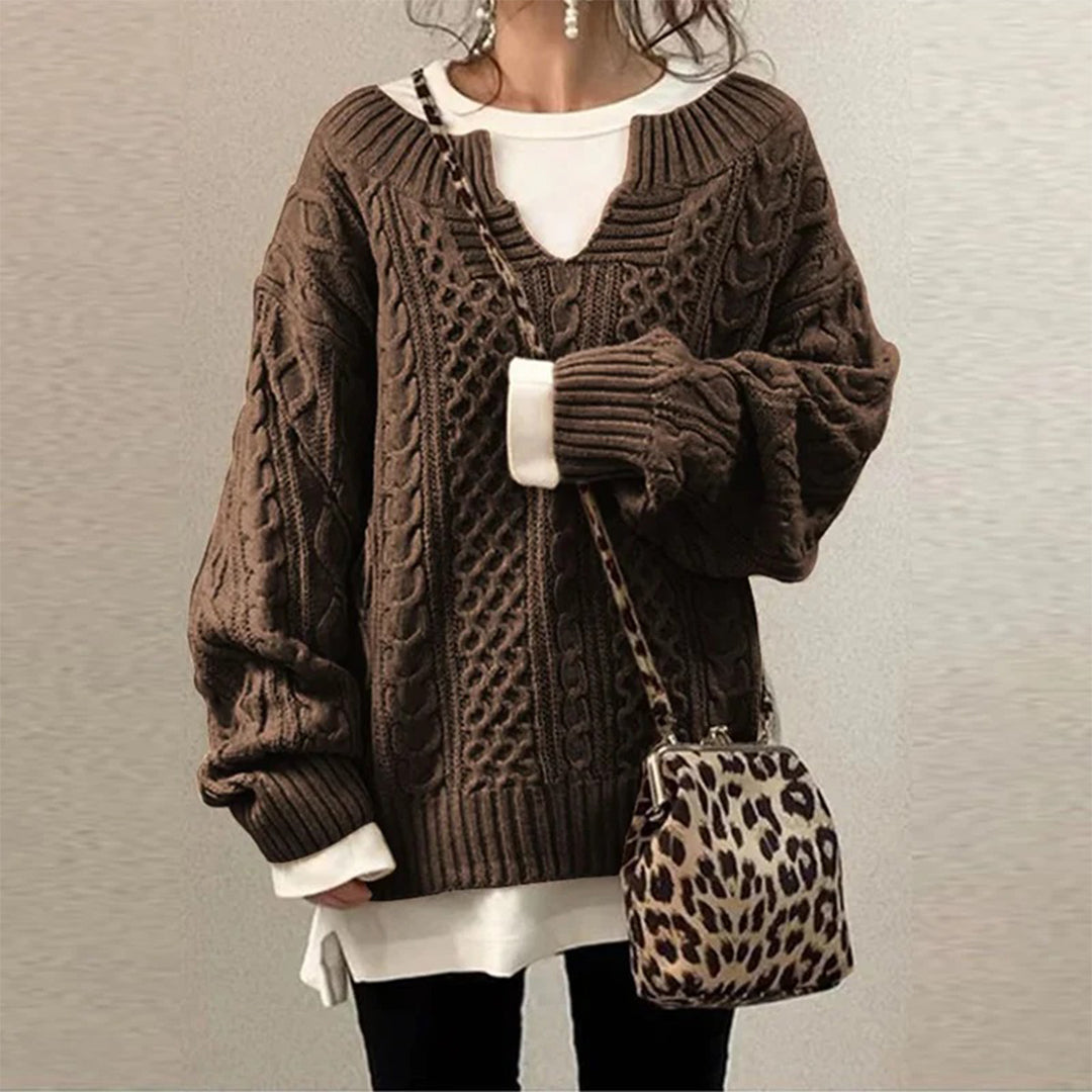 Oversized knit sweater with cable pattern