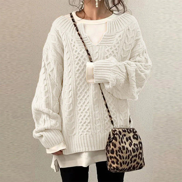 Oversized knit sweater with cable pattern