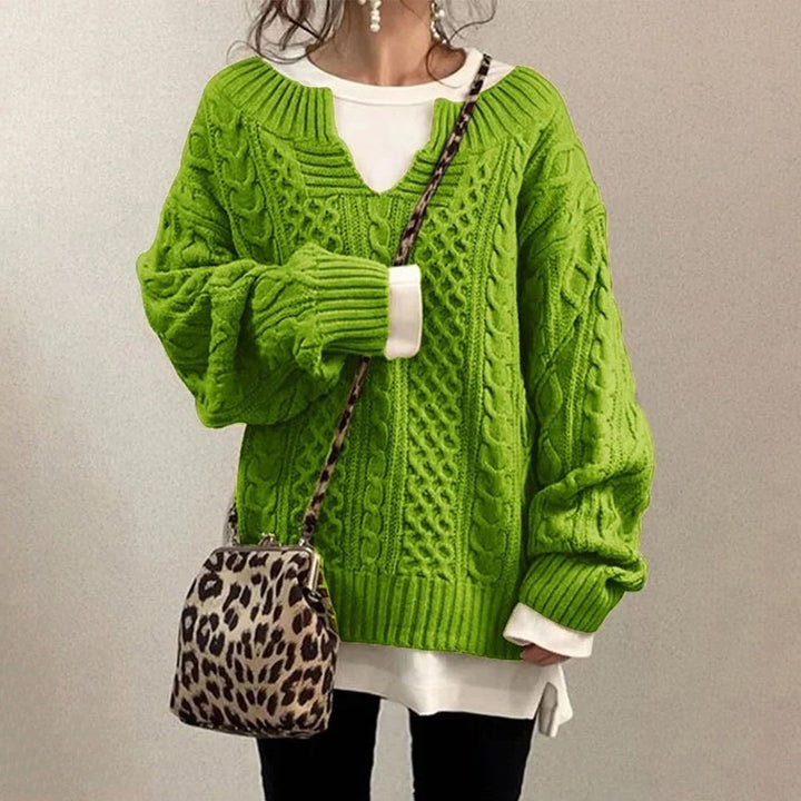 Oversized knit sweater with cable pattern